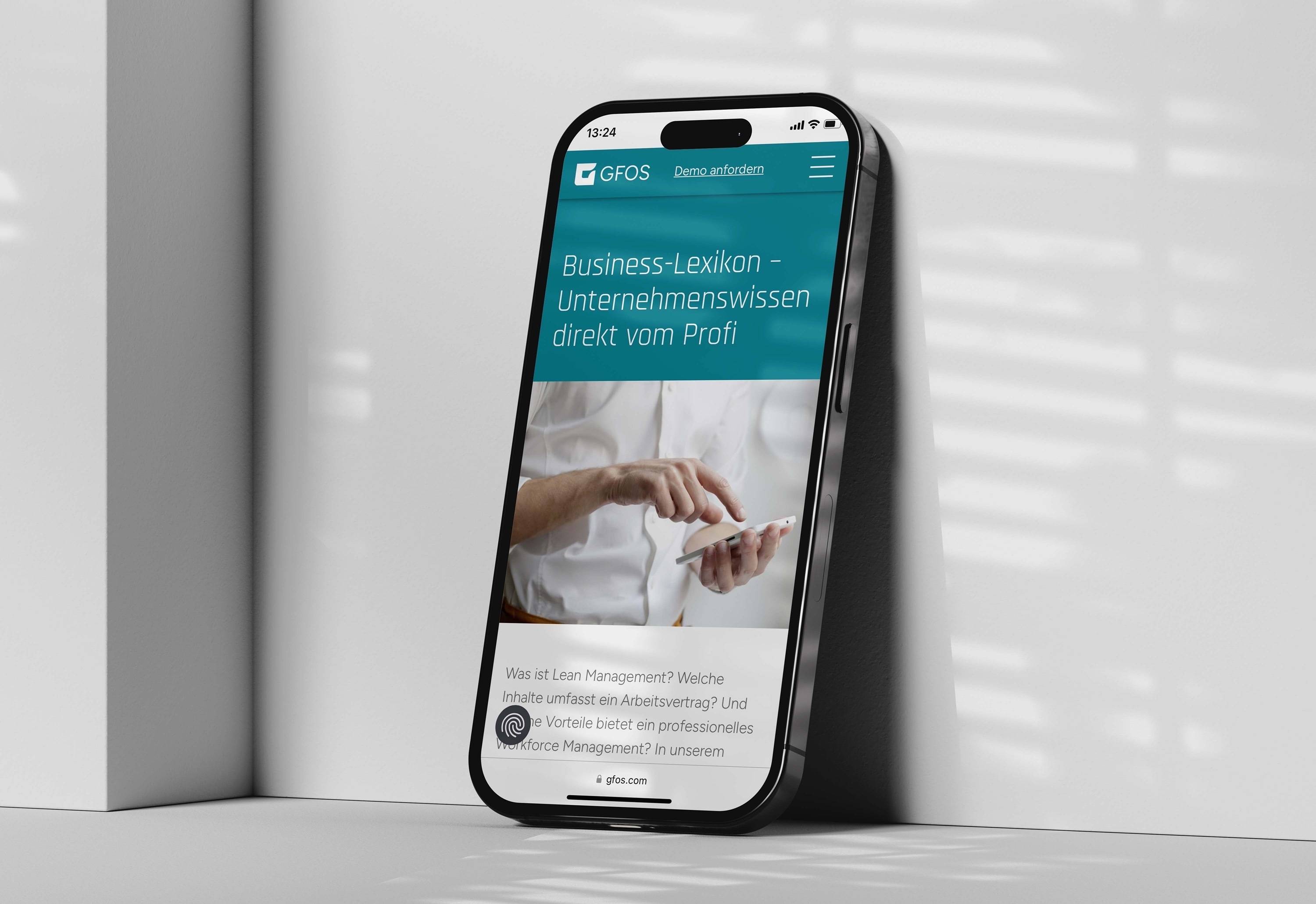 Website mockup of the GFOS brand on an iPhone screen